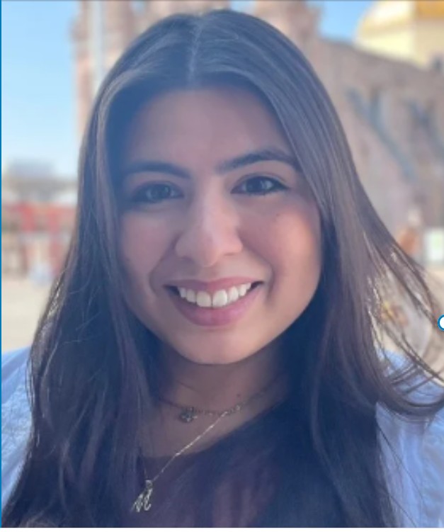 Marissa Esparza is a Latina SLP with straight brown hair. She is smiling at the camera 
